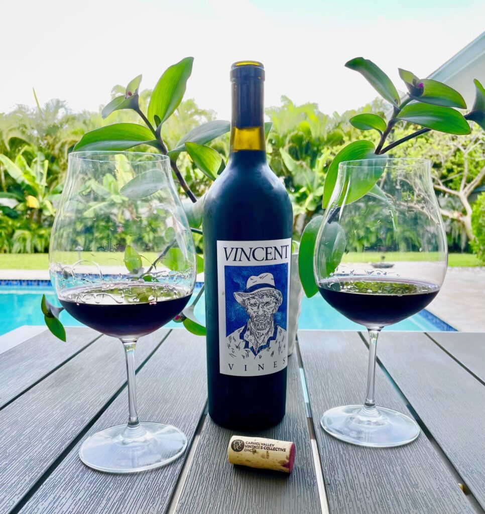 VINCENT VINES Estate Merlot poured by the pool with bottle and cork