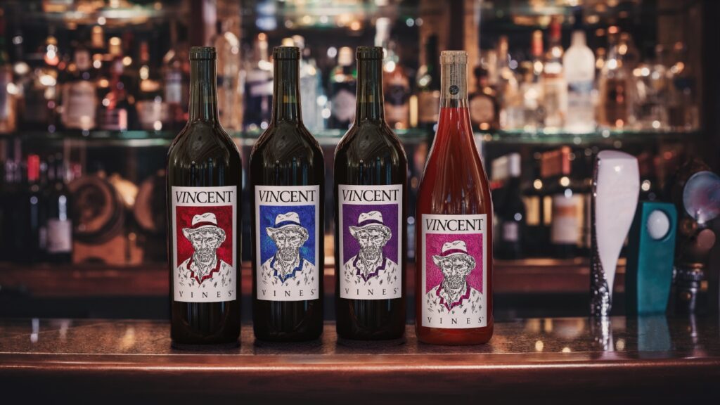 VINCENT VINES wine lineup displayed left to right on bar top: Cabernet Sauvignon, Estate Merlot, Petite Sirah, Rosé of Petite Sirah