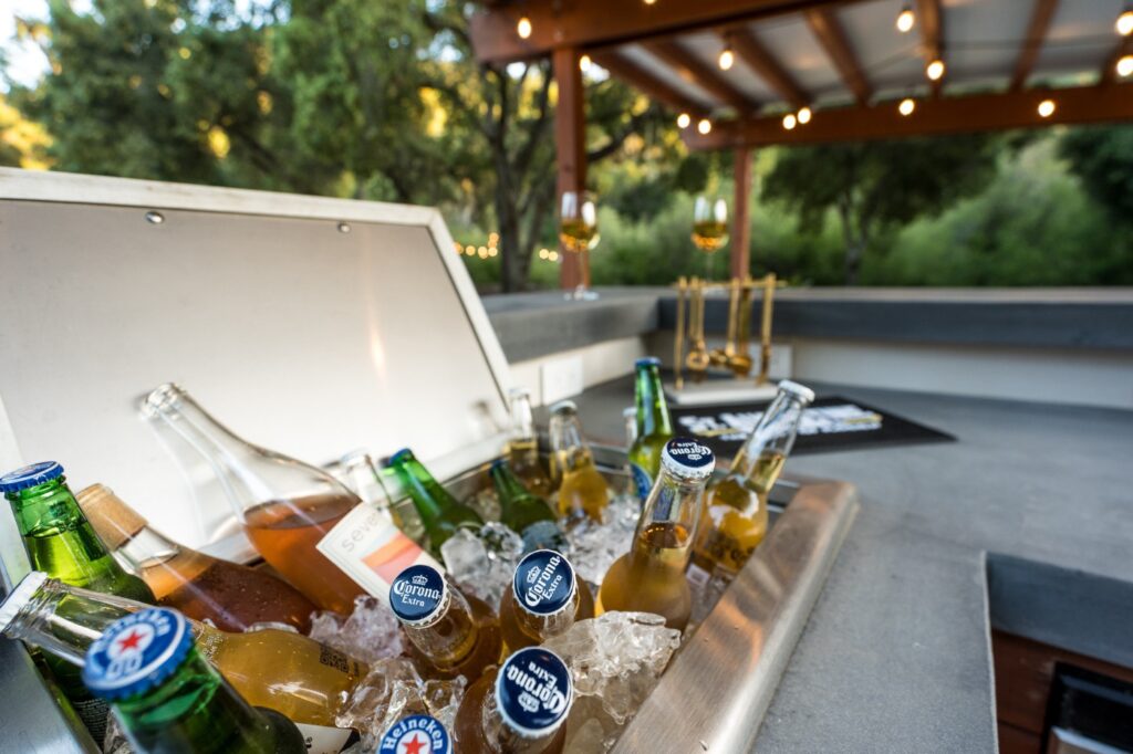 Ice chest filled with beer and ice under the poolside bar
