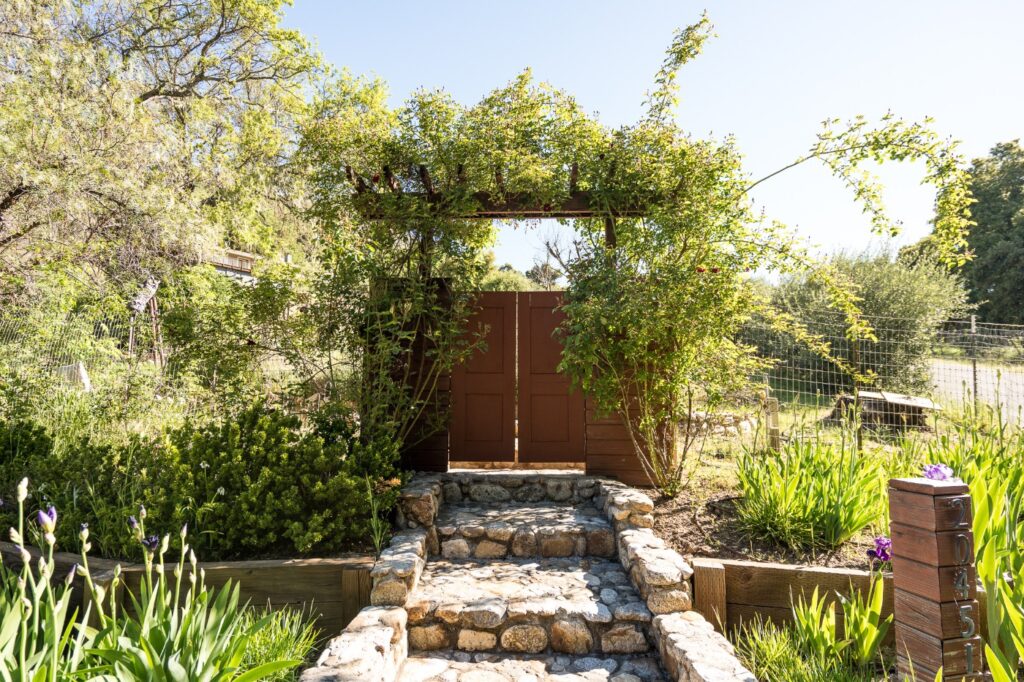 Steps up to the vineyard through the front gate at Vineyard Chateau, Carmel Valley