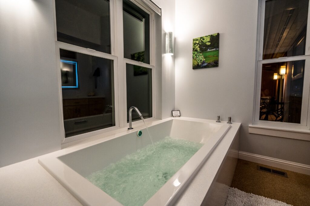 Champagne bubbler tub at night at Vineyard Chateau, Carmel Valley
