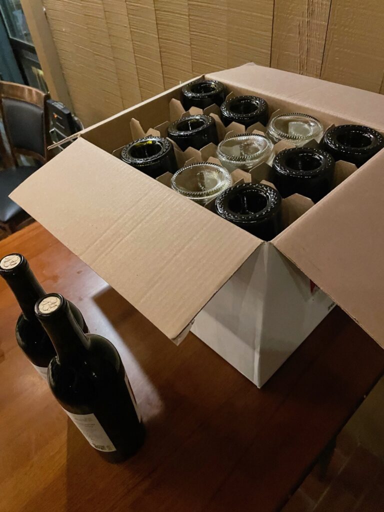 Case full of empty VINCENT VINES wine bottles